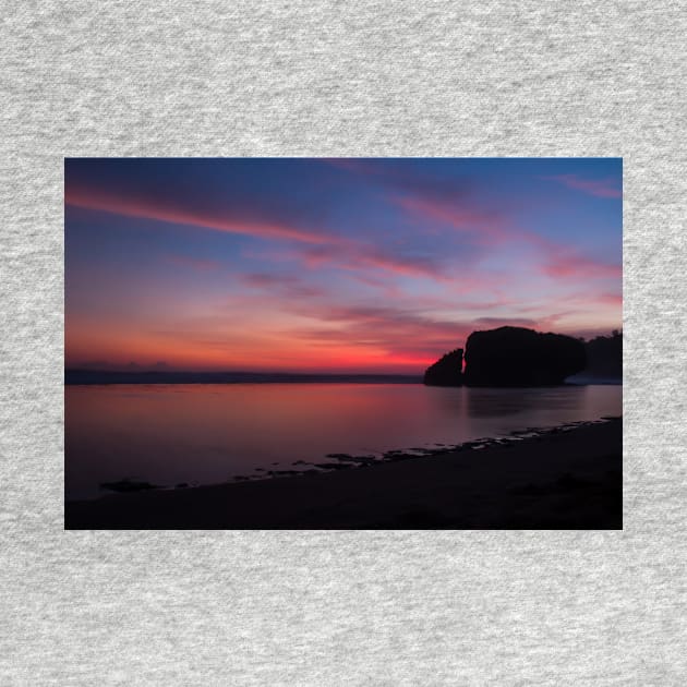 Silhouetted rock stack at a red sunset beach by kall3bu